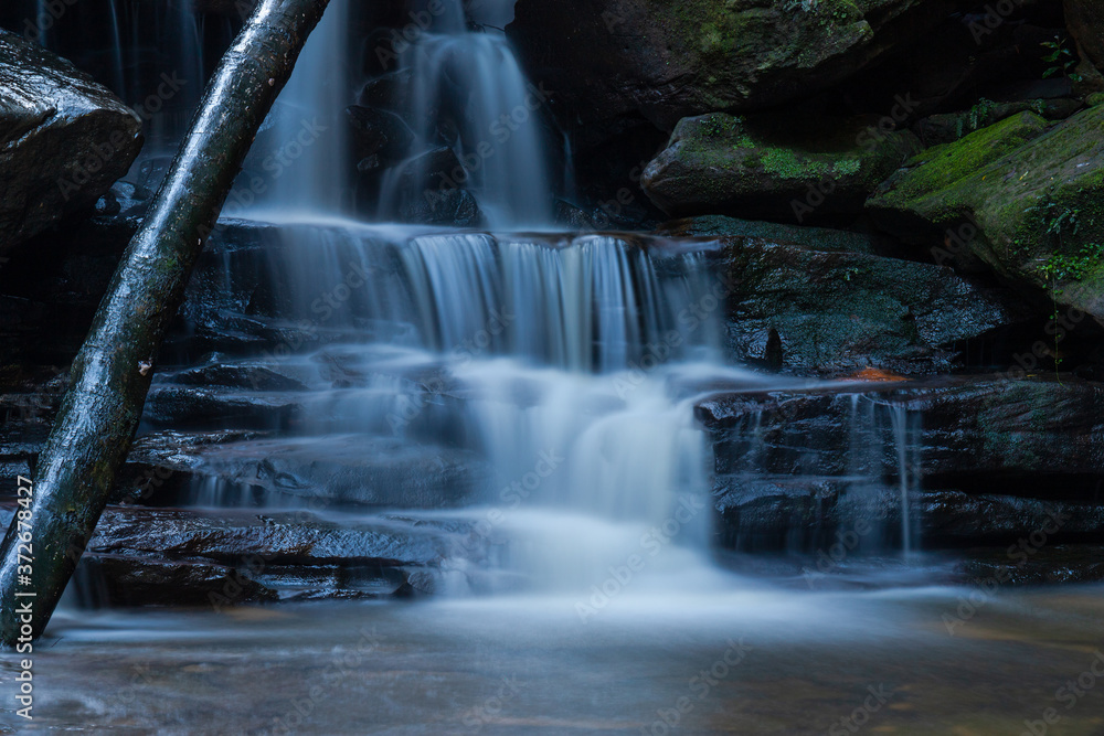 Water flowing through rock cascade.