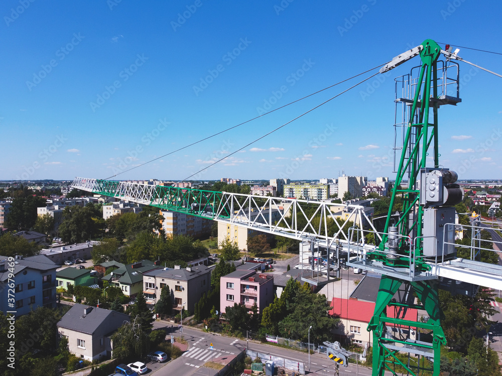 Tower crane in the city waiting to be used. Drone, aerial view