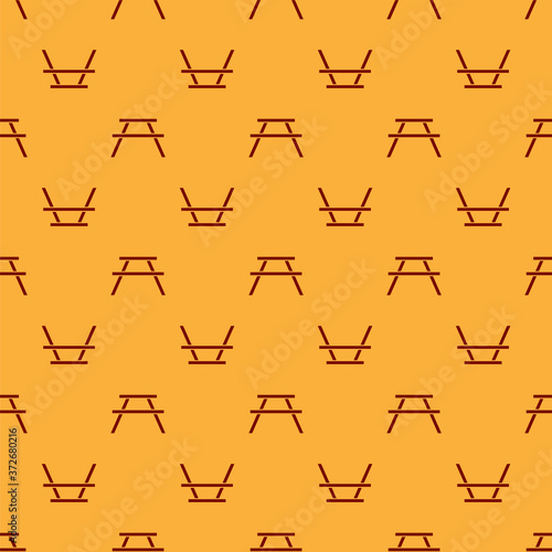 Red Picnic table with benches on either side of the table icon isolated seamless pattern on brown background. Vector Illustration.