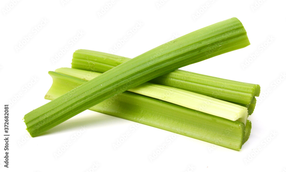 fresh celery stems on a white background fresh celery stems on a white background