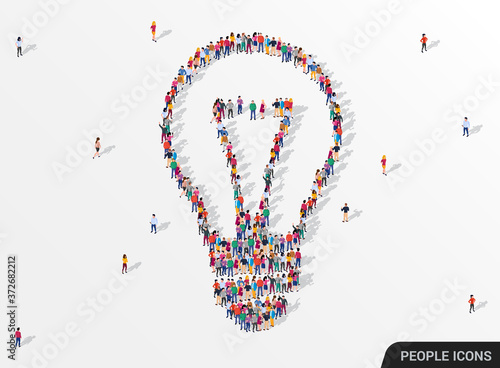 Large group of people seen from above gathered together in the shape of lightbulb. Idea and inspiration concept.