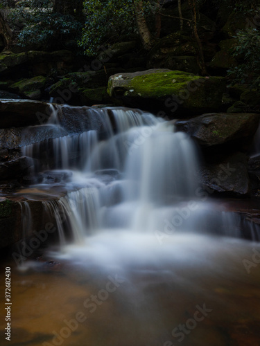 Water and rock cascade in tropical rainforest.