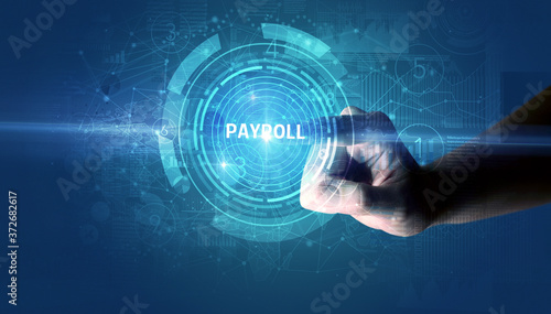 Hand touching PAYROLL button, modern business technology concept