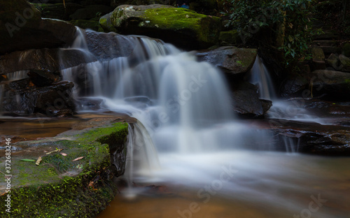 Water and rock cascade in tropical rainforest. photo