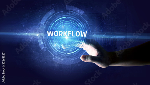 Hand touching WORKFLOW button, modern business technology concept