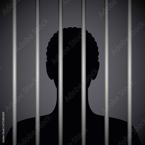 man in a prison behind jail bars silhouette vector illustration EPS10