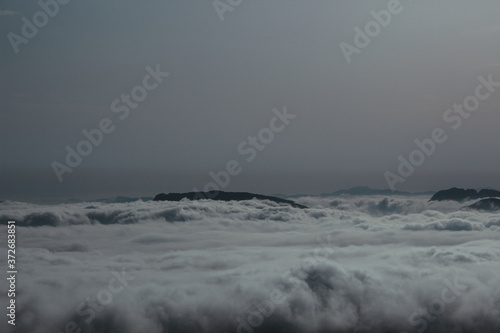 Wallpaper Mural Aerial view of mountain covered with clouds Torontodigital.ca