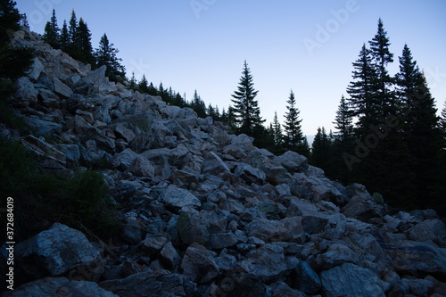 a scattering of kurumnik stones flows down the mountainside photo