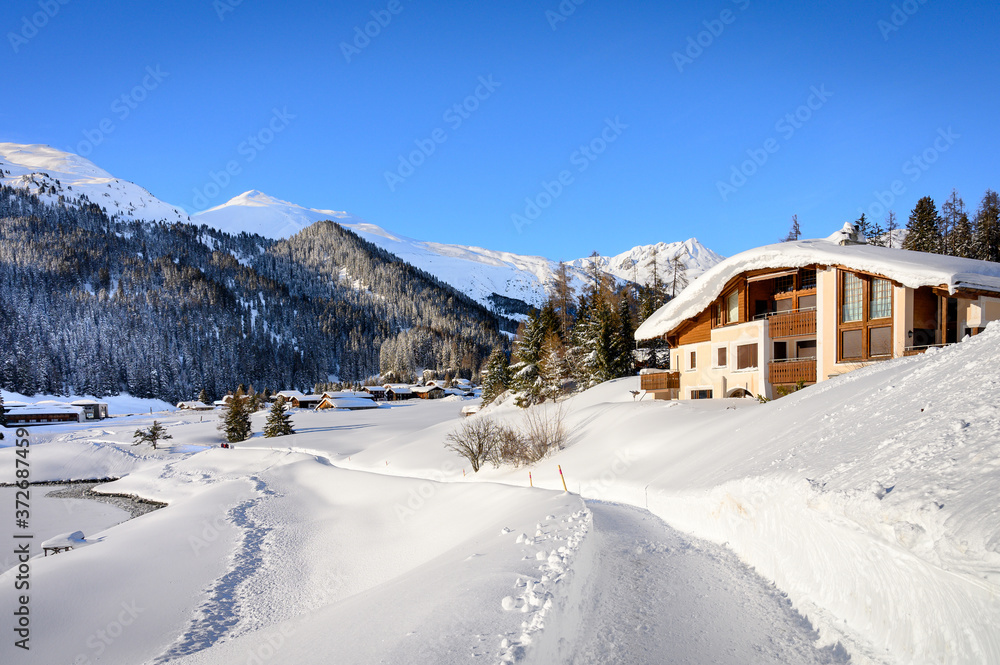 Landscape of lake Davos in winter resort Davos, Switzerland.