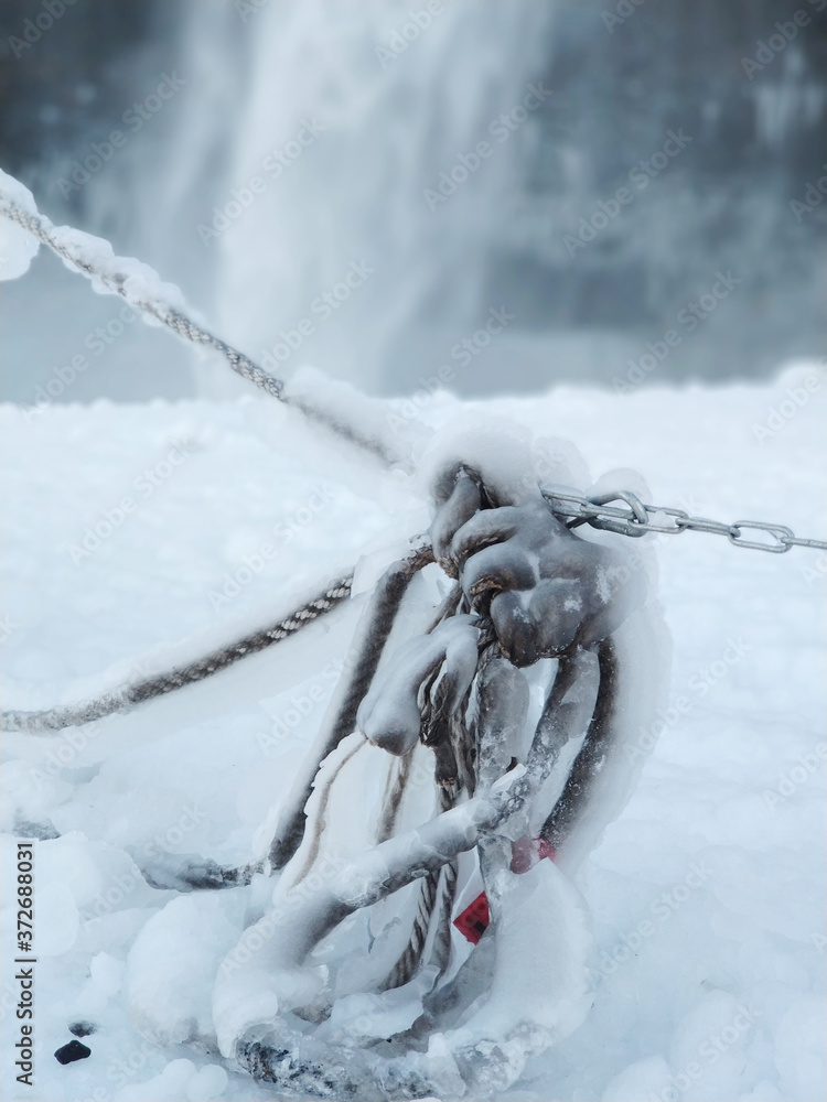 Fototapeta premium Frozen rope in winter. Huge icicles close up
