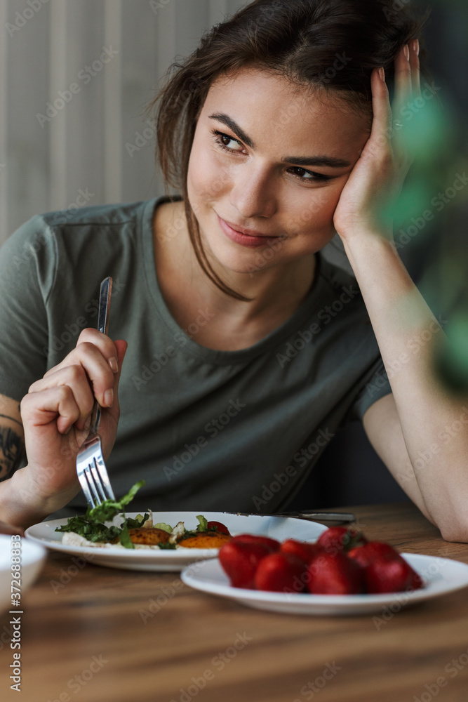 Attractive young woman having tasty healthy breakfast Attractive young woman having tasty healthy breakfast