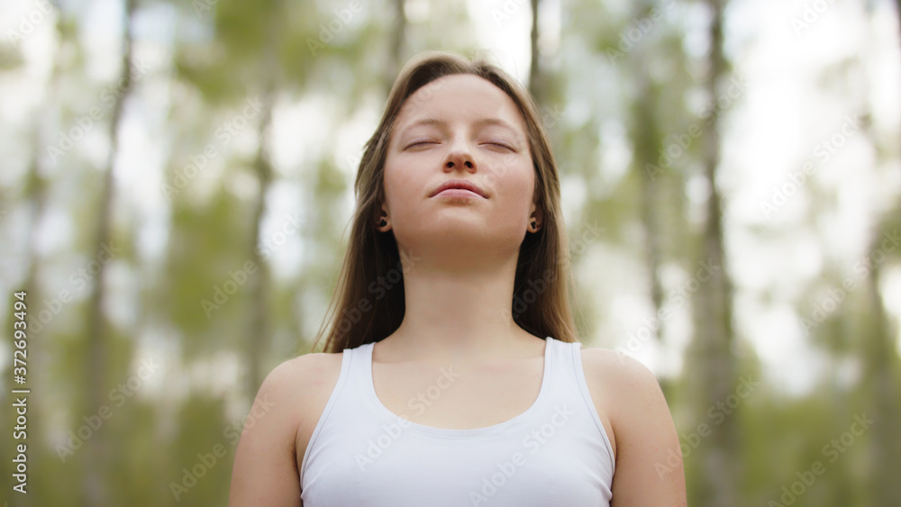 Portrait of a happy young caucasian woman, tourists enjoying fresh air and sun rays in the park. High quality photo Portrait of a happy young caucasian woman, tourists enjoying fresh air and sun rays in the park. High quality photo