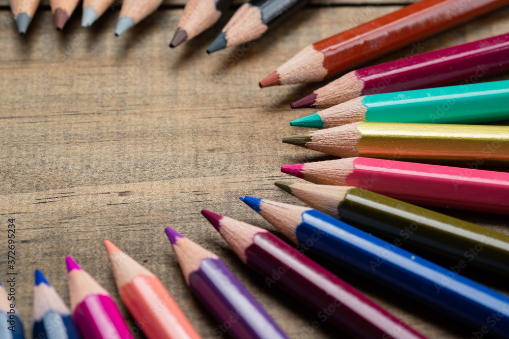 color pencil on wood background, back to school concept
color pencil on wood background, back to school concept