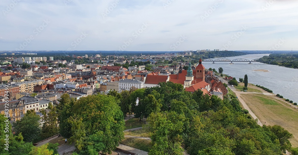 Vistula River flowing through the city of Grudziadz. Vistula River, largest river of Poland and of the drainage basin of the Baltic Sea.