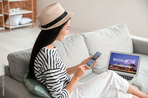 Woman with mobile phone boo...