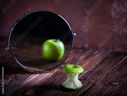 Fotografia Apple reflecting in the mirror surrealistic picture abstract vision , concept yo