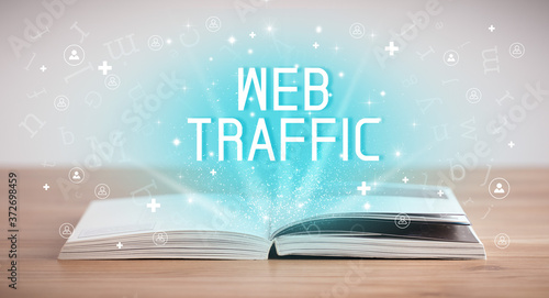 Open book with WEB TRAFFIC inscription, social media concept