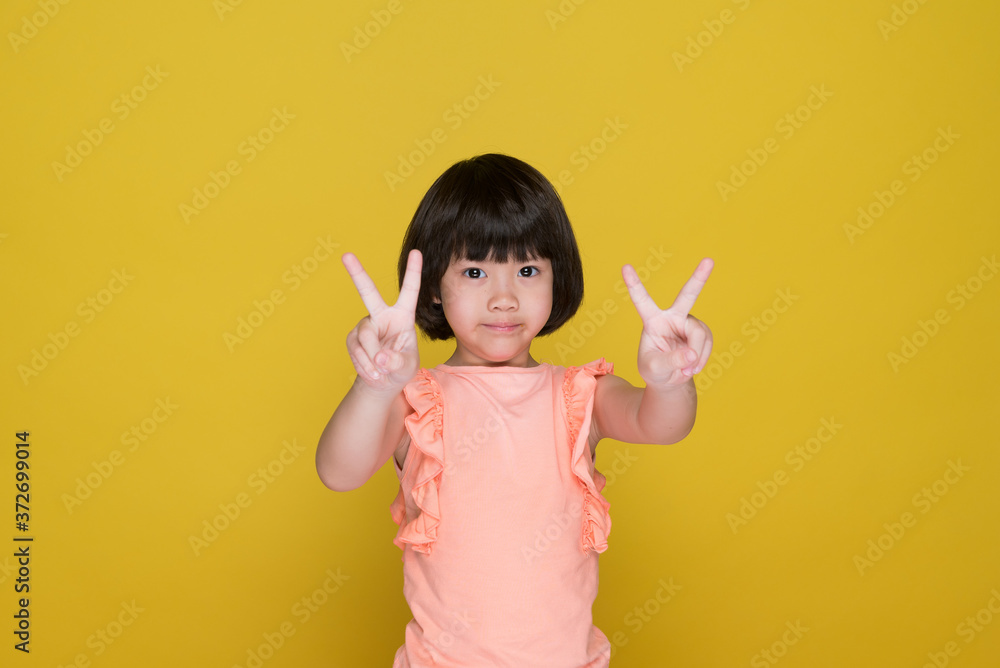 happy kid on yellow background, portrait child
happy kid on yellow background, portrait child