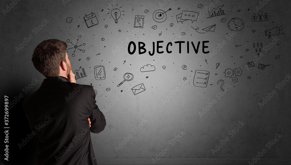 businessman drawing a creative idea sketch with OBJECTIVE inscription, business strategy concept