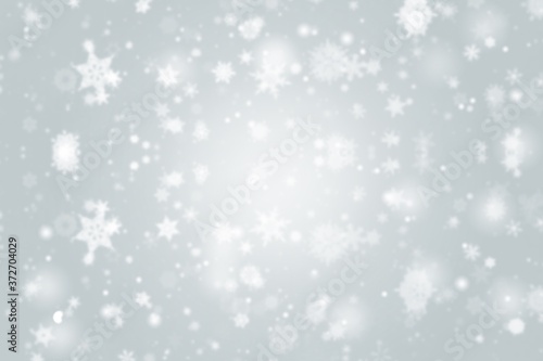 abstract christmas background with snowflakes gray white bokeh stars blurred beautiful shiny light, use for card new year wallpaper backdrop