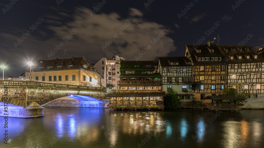 The water Reflection at night in the little France in Strasbourg in France