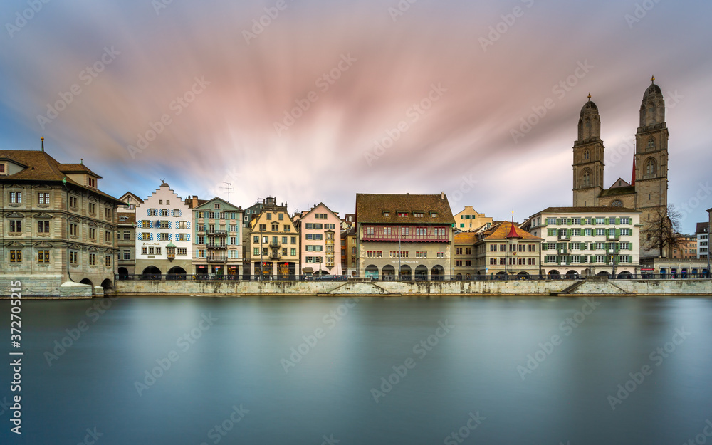 Limmat River at Sunset in Zürich, Switzerland. Panoramic long exposure of the view of historic Zurich city center and river Limmat , Switzerland Europe