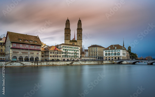 Grossmünster Cathedral in Zürich, Switzerland. Long Exposure of the Grossmünster Cathedral and old town from Limmat river.