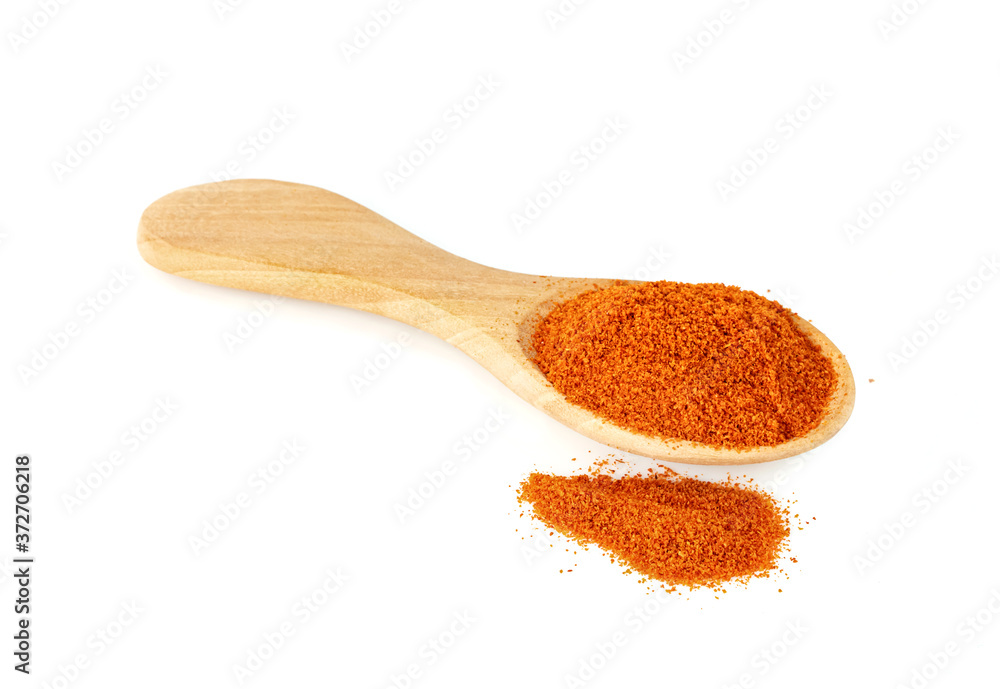 red ground paprika powdered or dry chili pepper with wooden spoon isolated on white background red ground paprika powdered or dry chili pepper with wooden spoon isolated on white background