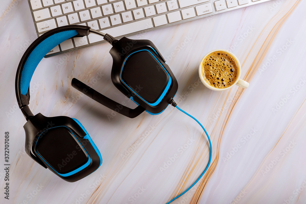 Call center support table with headset headphones with microphone, keyboard top view coffee espresso Call center support table with headset headphones with microphone, keyboard top view coffee espresso
