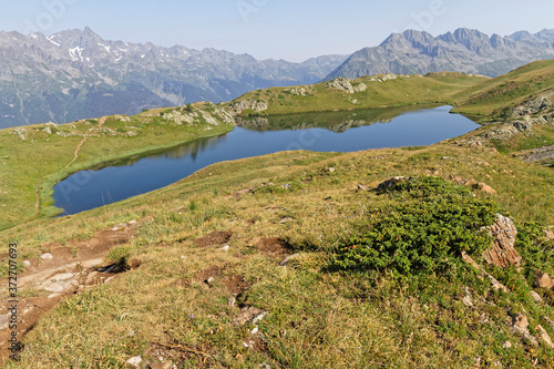 The Lac Noir (Black lake) and Belledonne mountain range in the background