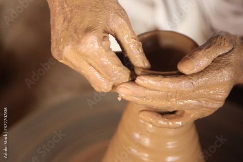 hands of a potter at work