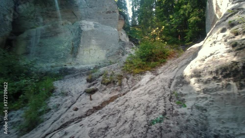 the Cliff of Sietiniezis Rock, Latvia. Gauja National Park. Pine Forest Tourist Trail With Pathwalk Near Sandstone Cliffs. photo