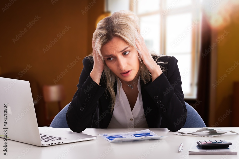 Shot of stressed young woman looking at paper document, bank debt notification, thinking of financial troubles. Lost in negative thoughts depressed woman worrying about bad news notice. Shot of stressed young woman looking at paper document, bank debt notification, thinking of financial troubles. Lost in negative thoughts depressed woman worrying about bad news notice.