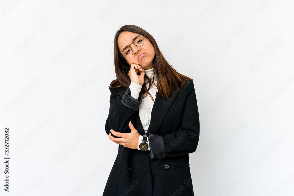 Young mixed race business woman isolated on white background who feels sad and pensive, looking at copy space. Young mixed race business woman isolated on white background who feels sad and pensive, looking at copy space.