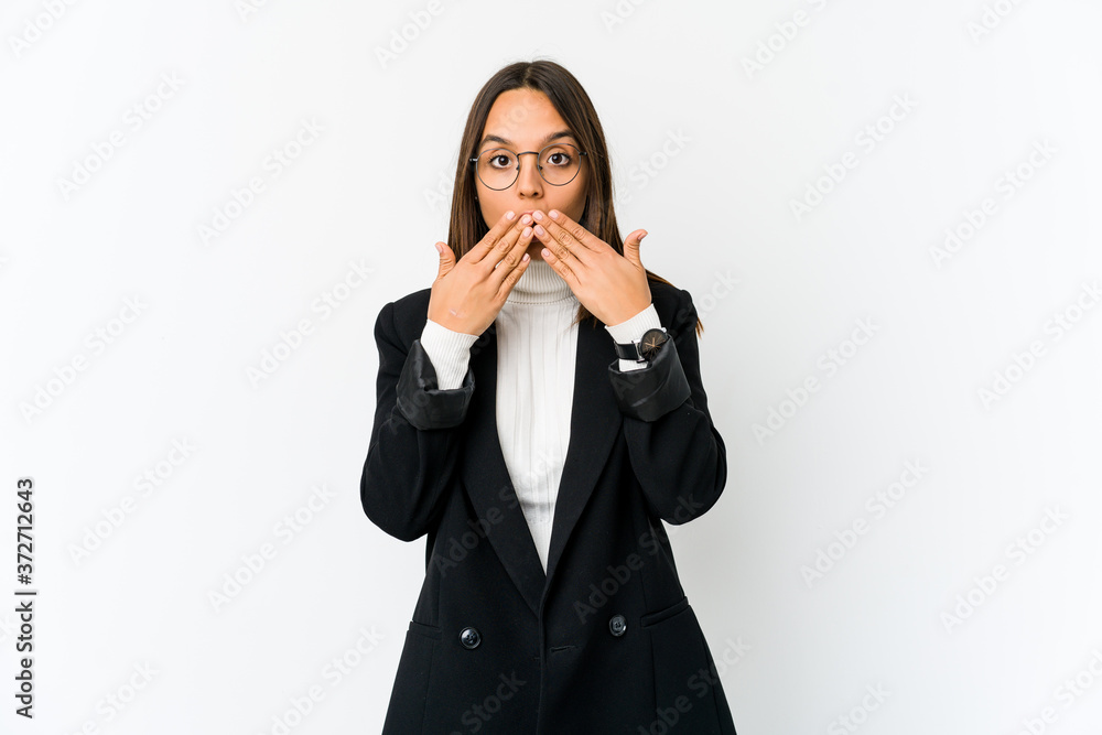 Young mixed race business woman isolated on white background shocked covering mouth with hands. Young mixed race business woman isolated on white background shocked covering mouth with hands.