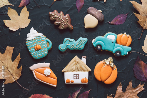 Hello Fall. Multicolored autumn cookies on a black background.  photo