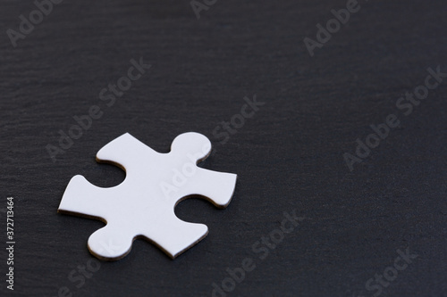 White jigsaw puzzle pieces on gray background