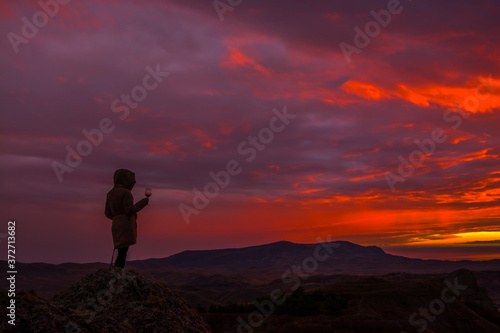 Girl in the mountains with wine