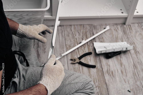 Furniture assembly process. Installation of fittings. Do it yourself.