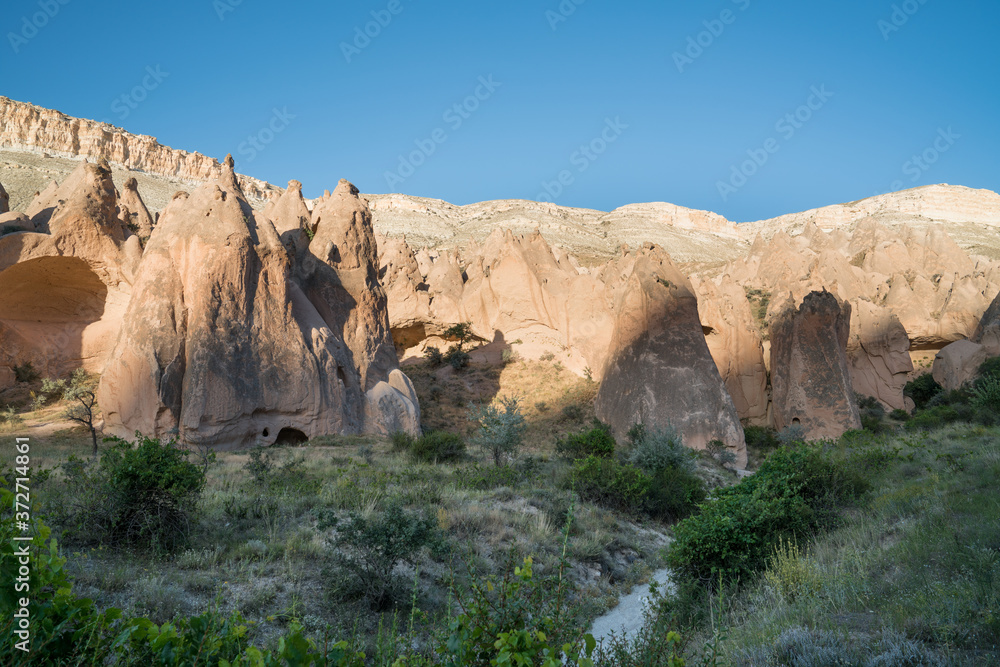 Cappadocia fairy chimneys and carved rock houses. Kapadokya is known as one of the best places to fly with hot air balloons worldwide. Goreme, Cappadocia, Turkey. Cappadocia fairy chimneys and carved rock houses. Kapadokya is known as one of the best places to fly with hot air balloons worldwide. Goreme, Cappadocia, Turkey.