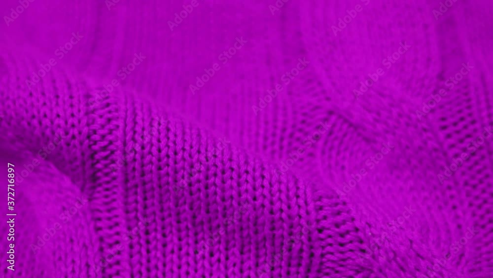 Close-up of the Lilac Purple Pink Knitted Fabric Texture. Cozy and Soft Cotton Plaid, Textiles, Clothing. Textile Factory. Garment Industry. Lilac Purple Abstract Background Close-up of the Lilac Purple Pink Knitted Fabric Texture. Cozy and Soft Cotton Plaid, Textiles, Clothing. Textile Factory. Garment Industry. Lilac Purple Abstract Background