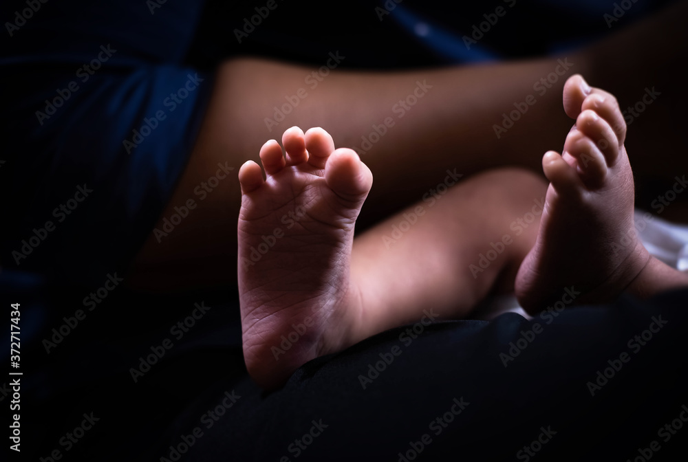 Closeup sole of newborn baby foot,blurry light around