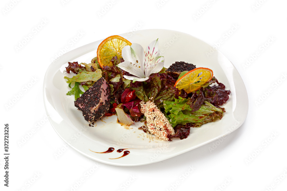 Salad with grilled beef slices and lettuce isolated on white Salad with grilled beef slices and lettuce isolated on white
