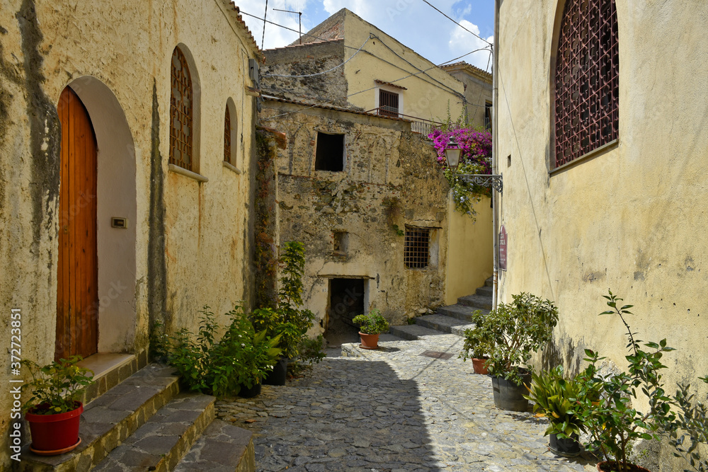A narrow street among the old houses of Scalea, a rural village in the Calabria region.