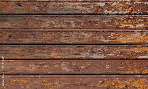 Brown wooden background with old painted boards