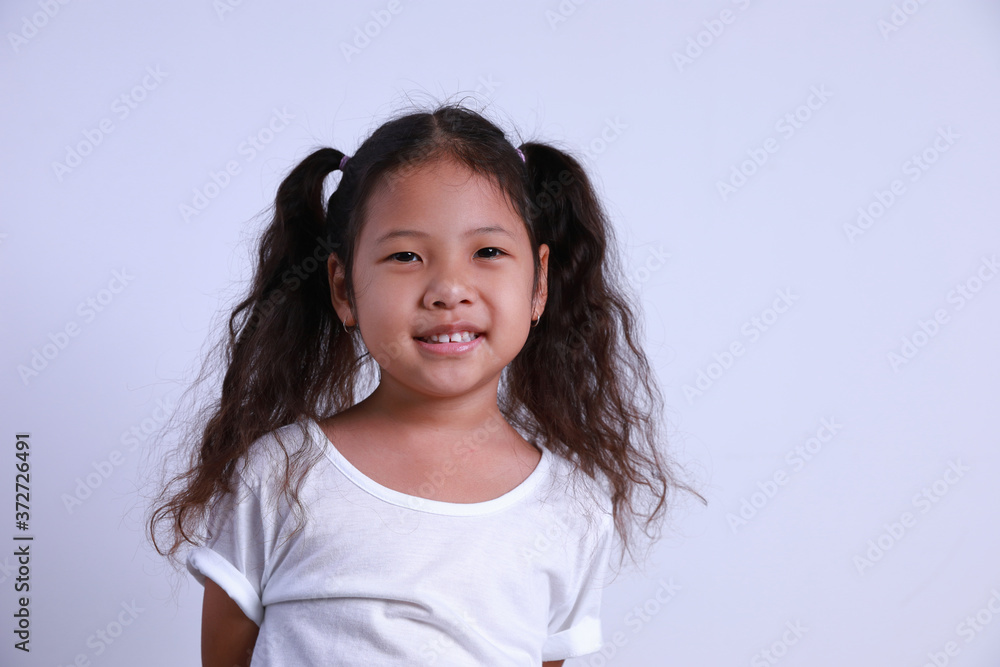 Little Asian kid girl beautiful smile happiness portrait looking at the camera. Little Asian kid girl beautiful smile happiness portrait looking at the camera.