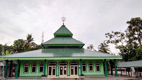 Full view of worship place, mosque with green building design. Parepare, Indonesia photo