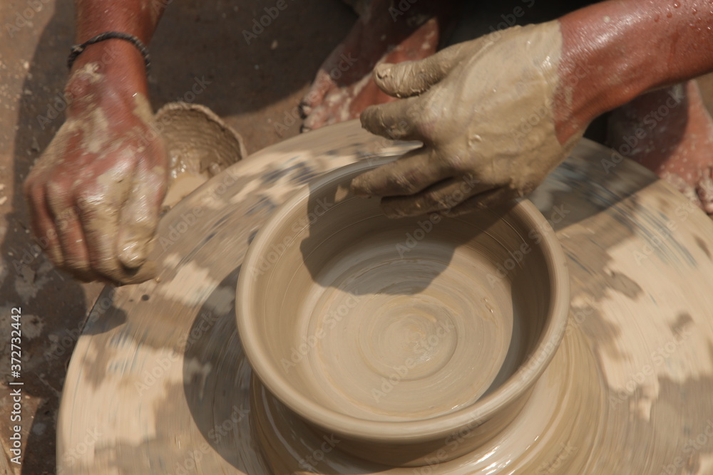 Potter at work, clay molding, man work clay, potter man Potter at work, clay molding, man work clay, potter man