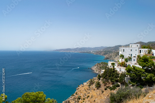 beautiful white house on top of a cliff