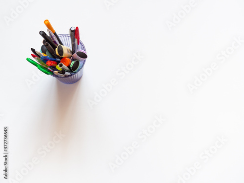 Assorted office or school colorful stationery on white background. Flat lay top view with copy space. back to school or creative education craft design concept.